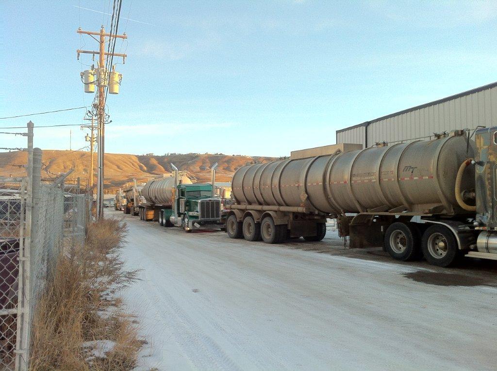 2012 Water hauling trucks lined up at Town Cochrane potable water, sourced from Bow River