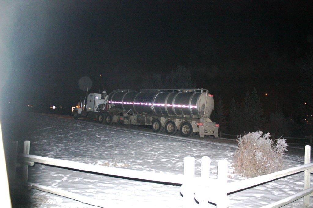 2012 12 02 Tanker hauling water for drilling, fracing, from Bow River, under Hwy 22 Bridge in Cochrane