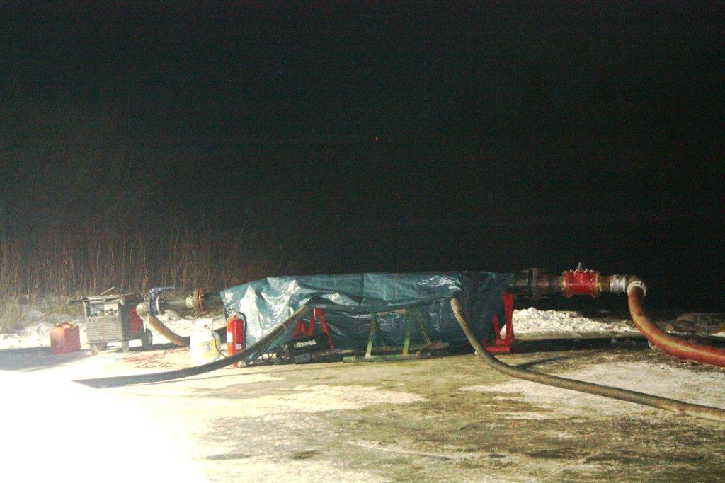 2012 12 09 Frac'ers taking water from Bow River, under bridge hwy 22 s cochrane, under AENVs temporary diversion licence