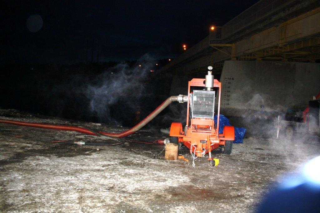 2012 12 09 Frac'ers's taking water directly from Bow River, Alberta, under bridge hwy 22 at cochrane, under AENVs temporary diversion licence