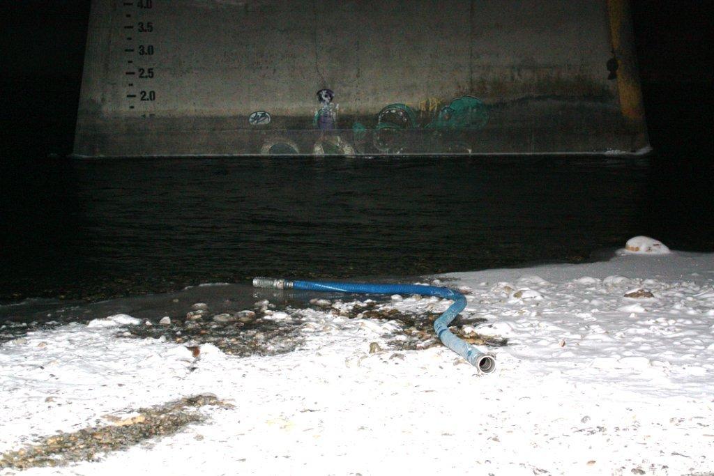 2012 12 Frac'ers' water taking hoses from Bow River, under bridge hwy 22 s cochrane, under AENVs temporary diversion licence 002