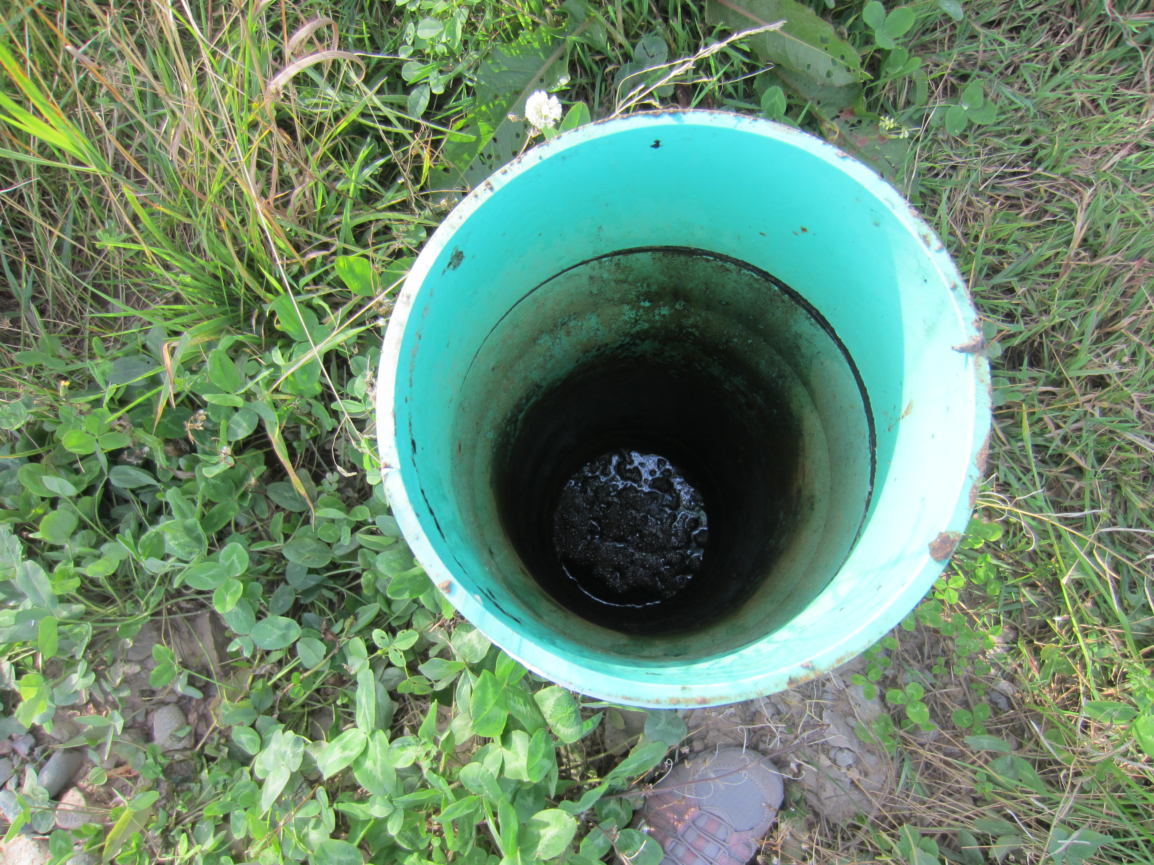 2013 09 Oil Gas Industry garbage left on Shoal Point, NL, oil sheen in water monitoring well, where's the data