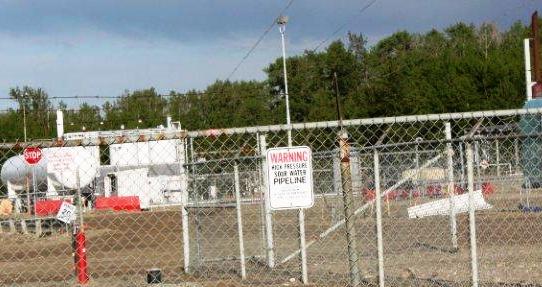 2014 close up Bonavista South Rosevear Gas Plant. warning sign, high pressure sour water pipeline, 16-11-54-15 W5M, near Edson, Alberta