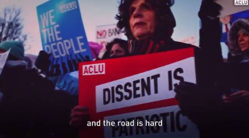 2017 03 15 snap from video by ACLU w Roger Baldwin, one of founders ACLU, dissent sign, 'the road is hard'