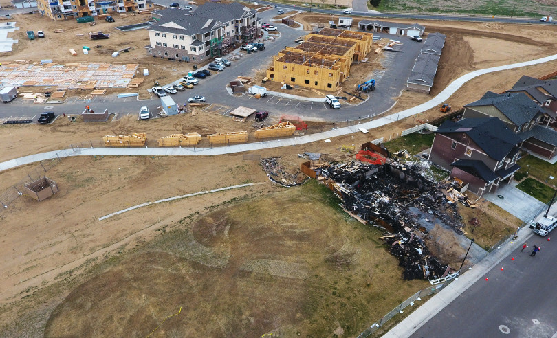 FIRESTONE, CO - APRIL 27: A gas well, on the left, covered by tan fencing is less than 200 feet from a home where crews continue to investigate a fatal house explosion on April 27, 2017 in Firestone, Colorado. Anadarko Petroleum plans to shut down 3,000 wells in northeastern Colorado after the fatal explosion. (Photo by RJ Sangosti/The Denver Post)