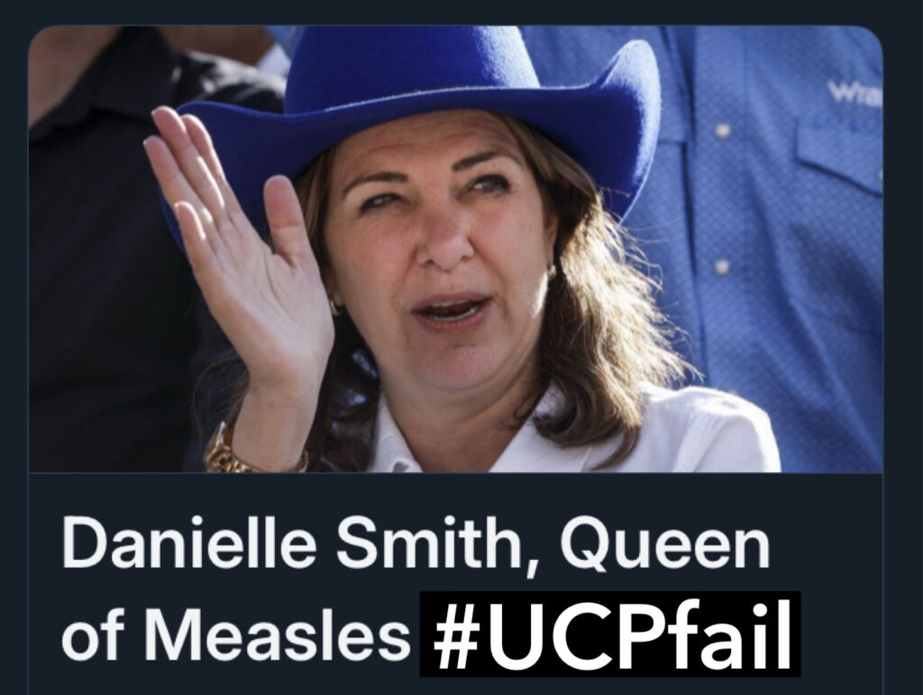 Photo of Alberta Premier Danielle Smith in an ugly felt blue cowboy hat and white blouse, waving, with text: "Danielle Smith, Queen of Measles #UCPfail
