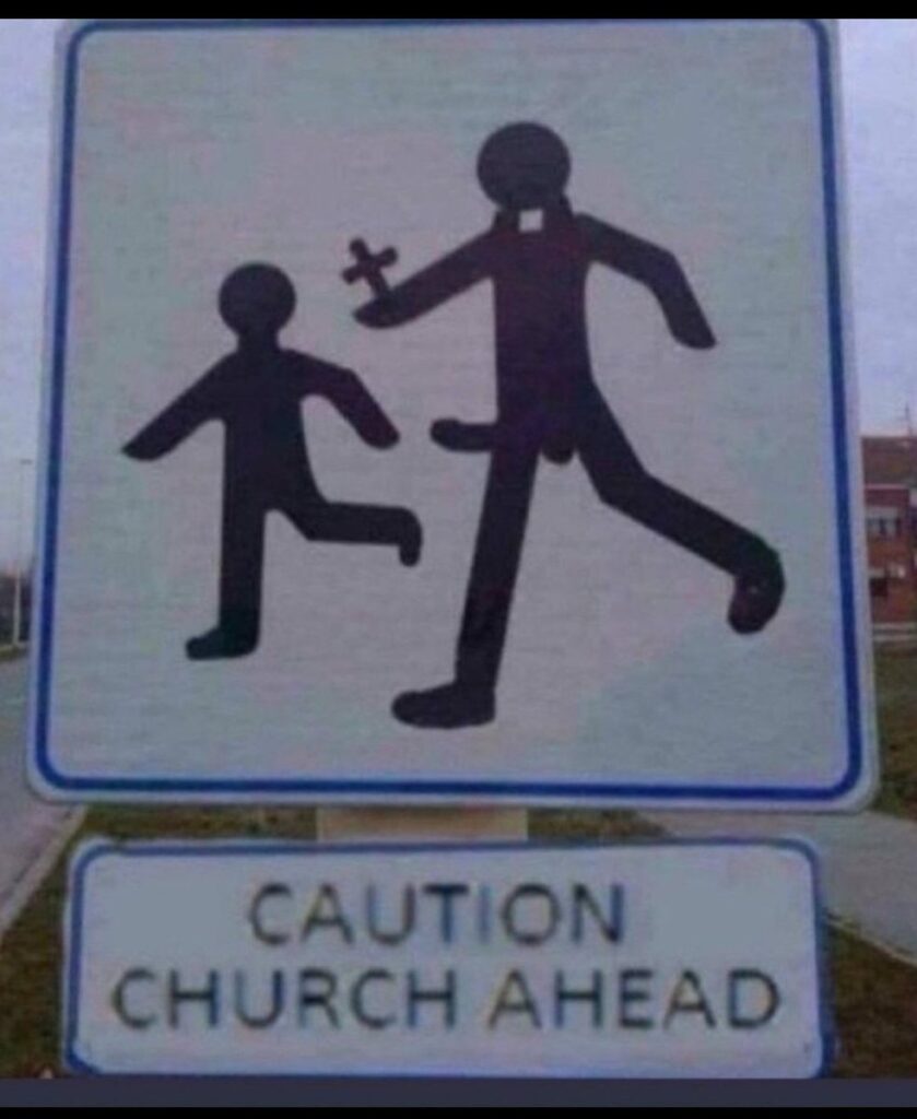 Photo of a hand made sign in front of a building showing a priest with a hard on chasing a child. Text says, "Caution, Church Ahead"